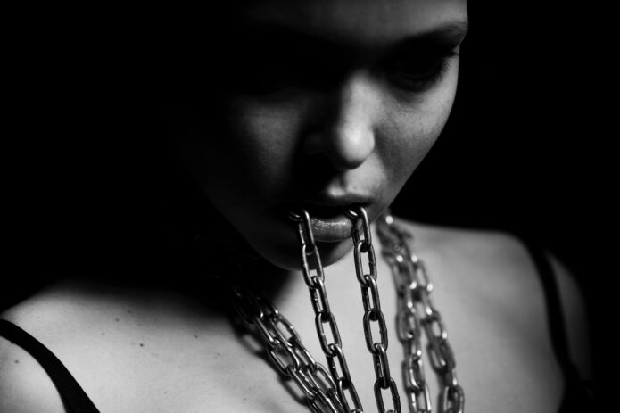 woman-biting-chain-min